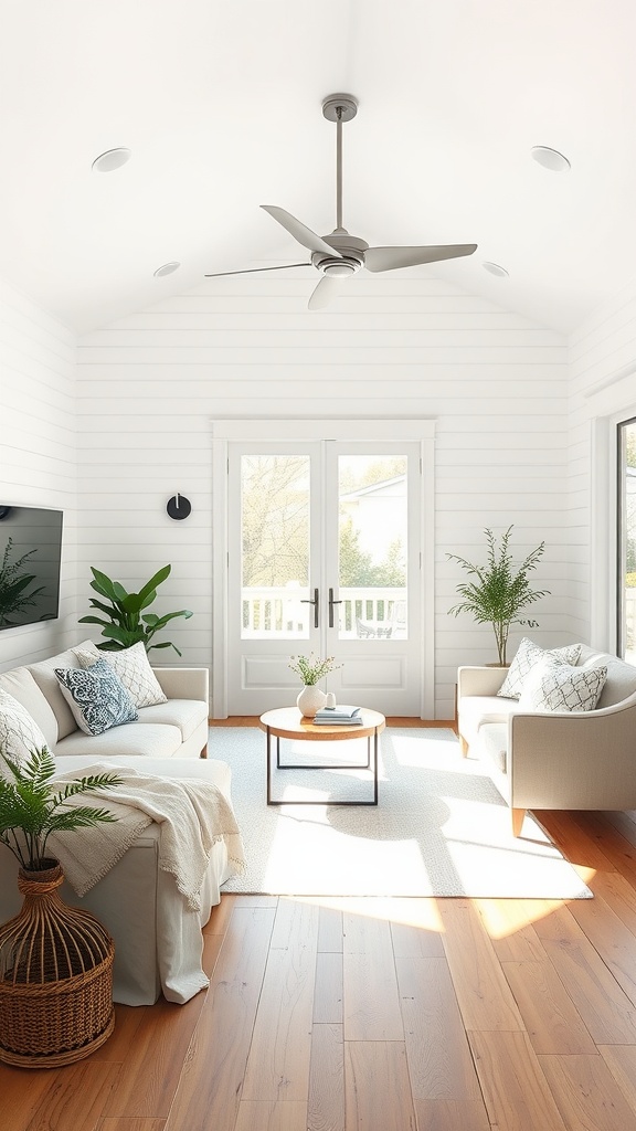 Bright and airy living room with shiplap walls, natural wood flooring, and cozy furniture.