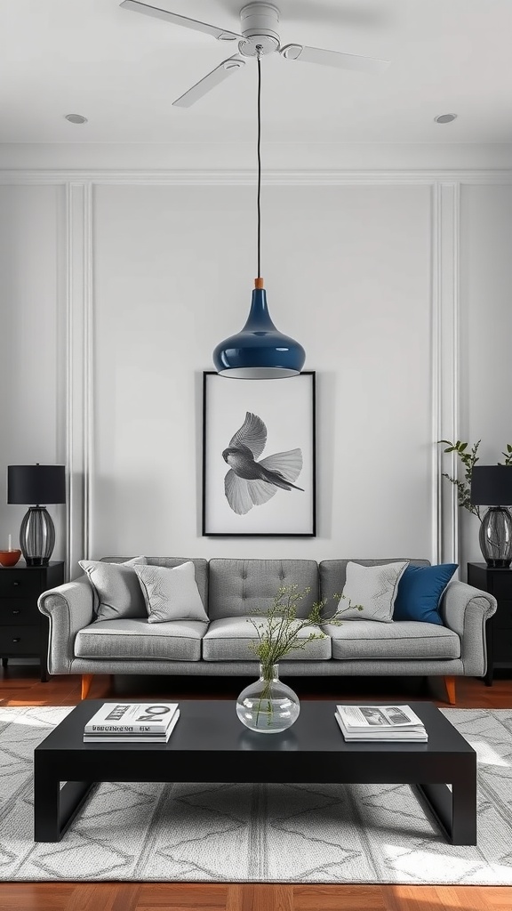 A stylish living room featuring a navy blue pendant light above a gray sofa, complemented by black accents and a decorative coffee table.