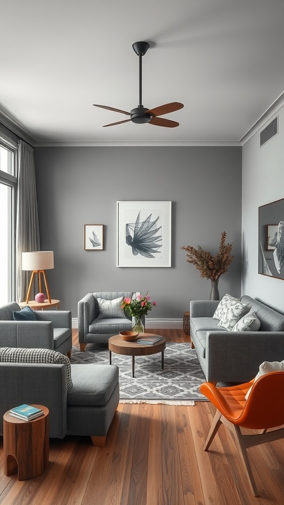 A cozy living room featuring gray sofas, a wooden coffee table, and an orange chair, with gray walls and a patterned rug.