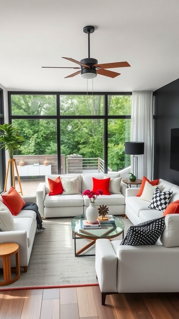 Modern living room with white sofas, colorful pillows, and large windows overlooking greenery.