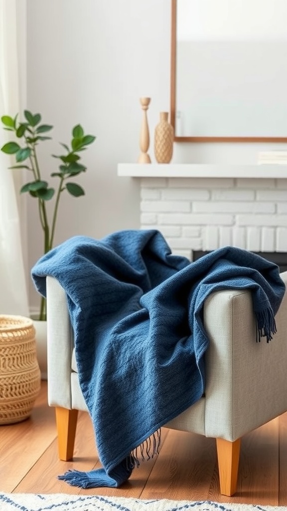 A soft navy blue throw blanket draped over a light-colored armchair in a cozy living room setting.