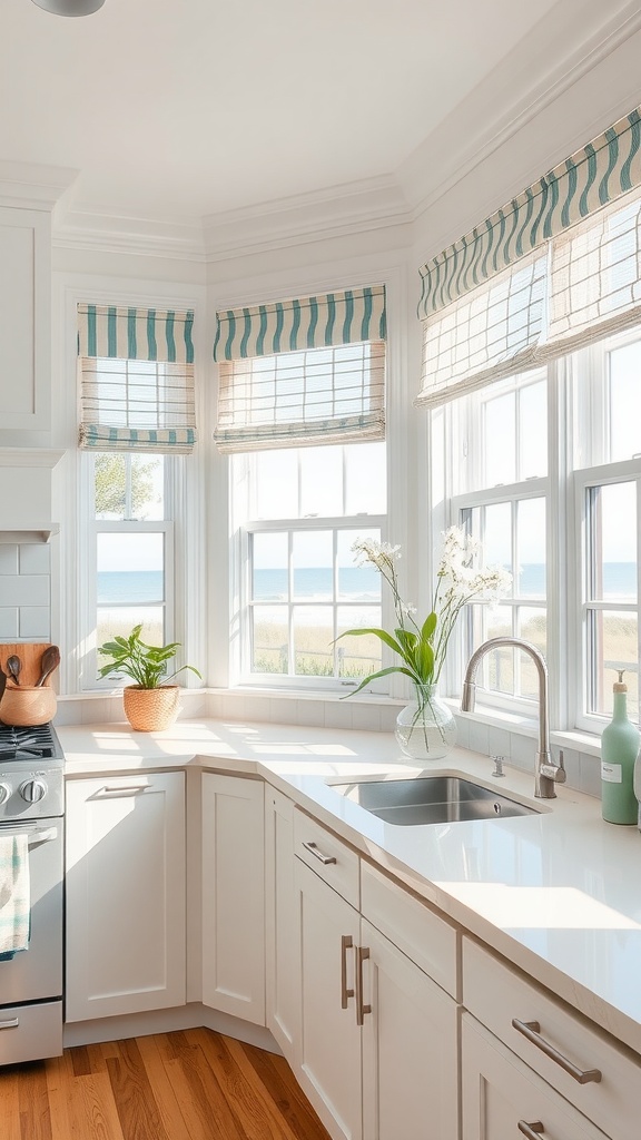 A bright beach house kitchen with striped window treatments and a view of the ocean.