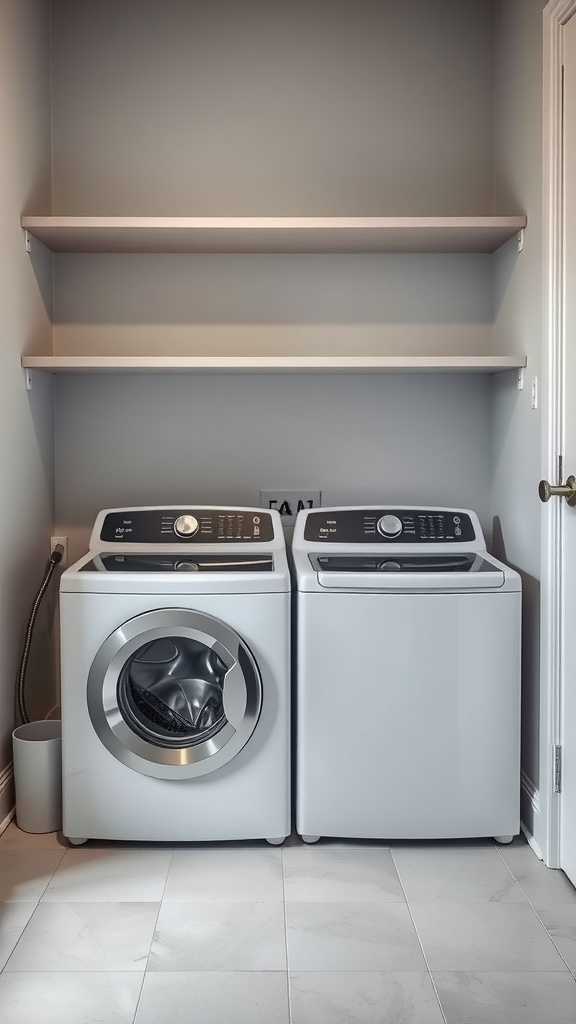 A clean laundry room with a front-loading washing machine and a top-loading dryer side by side against a wall, with shelves above for storage.