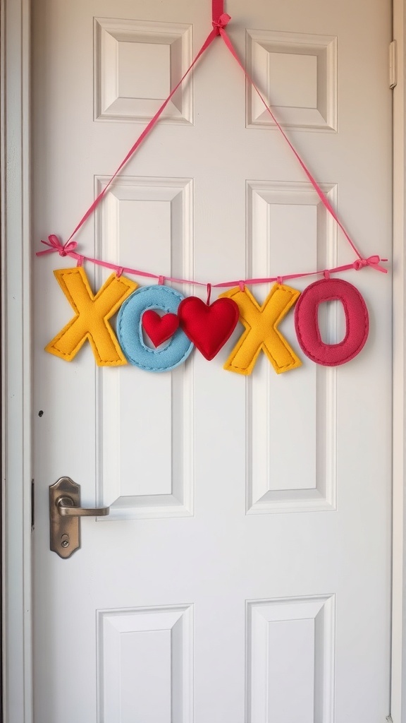 Colorful XOXO felt banner hanging on a door